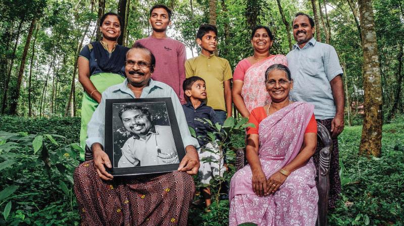 Baijus family with his photo.