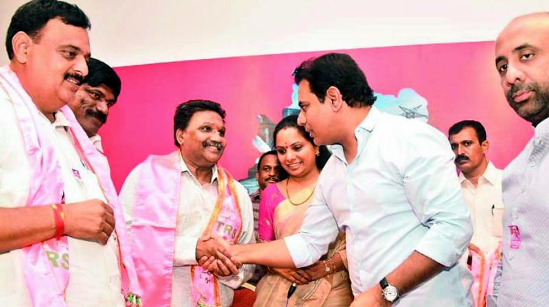TD Telangana state rice millers association general secretary Vaddi Mohan Reddy and Gampa Nagendar and their followers joined the TRS at Telangana Bhavan in the presence of minister K.T. Rama Rao and Nizamabad MP Kalvakuntla Kavitha on Monday. (Photo:DC)