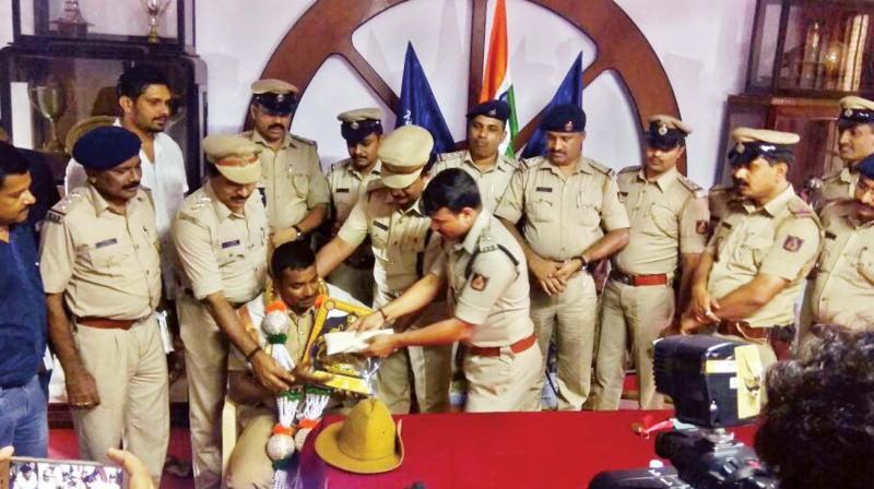 Chandrakumar C. being felicitated.