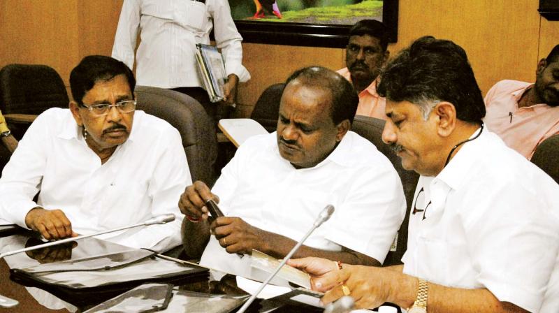 Chief Minister H.D. Kumaraswamy, DyCM G. Parameshwar and Water Resources Minister D.K. Shivakumar at a meeting on Cauvery issue in Bengaluru on Monday. (Photo: KPN )
