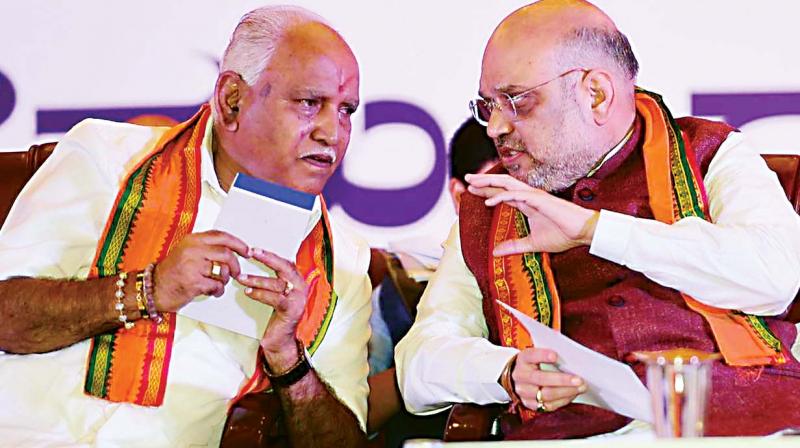A file photo of BJP chief Amit Shah with state unit president B.S. Yeddyurappa.