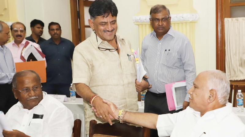 Minister D.K. Shivakumar greets state BJP president B.S. Yeddyurappa at the all- party meeting on the Cauvery issue in Bengaluru on Saturday. (Photo: DC)