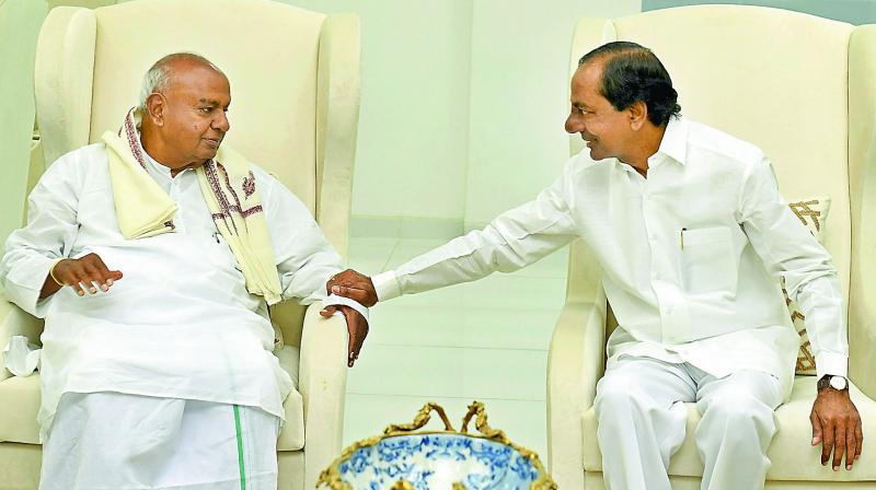Former prime minister H.D. Deve Gowda meets Telangana state Chief Minister K. Chandrasekhar Rao, in Hyderabad on Sunday.