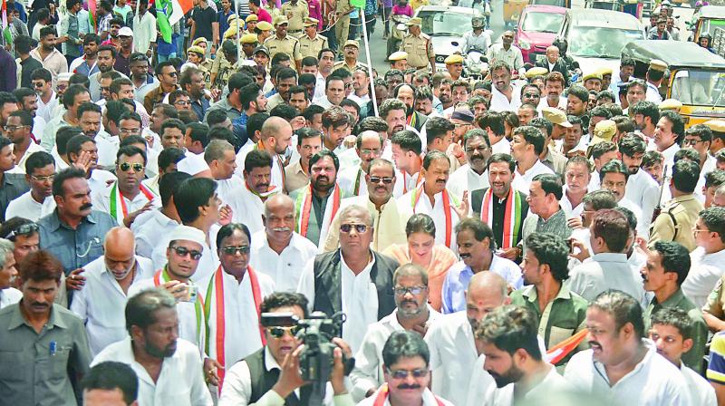 Congress leaders and party workers take out a march from Gandhi Bhavan to Genaral Post Office at Abids on Monday. (Photo: S. Surender Reddy)