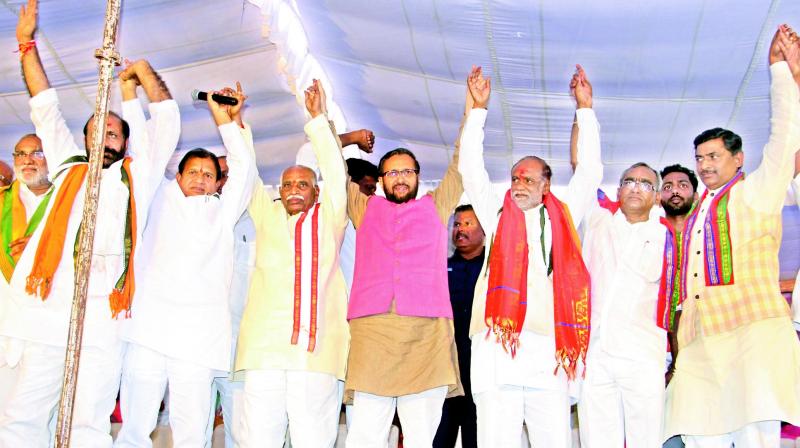 Union HRD minister Prakash Javadekar (centre) at a public rally held in Suryapet on Friday to mark the conclusion of the first phase of the Praja Chaitanya Yatra undertaken by BJP state president Dr K. Laxman. (Photo: DC)