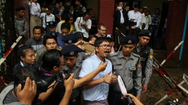 Detained journalist Wa Lone speaks to the media after exiting the court. (Photo: AFP)