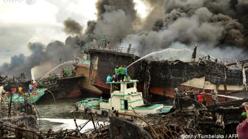 Images from Benoa port, which sits next to the popular tourist hub of Kuta, showed flames shooting into the night sky and huge plumes of black smoke. (Photo: AFP/Twitter)