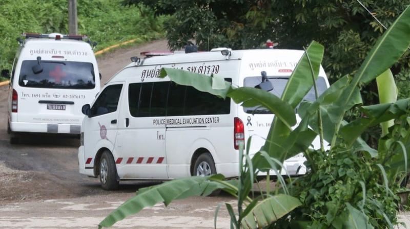 Two ambulances arrive near the cave to wait for evacuations of the boys and their soccer coach on the first day of the extraction mission. (Photo: AP)