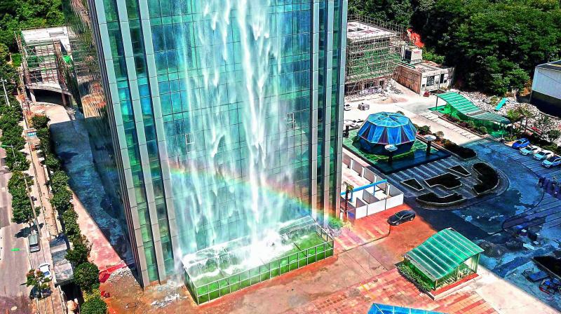 A rainbow caused by a 108-metre-high artificial waterfall on the facade of the Liebian International Building in Guiyang in Chinas Guizhou province. ( Image: AFP )