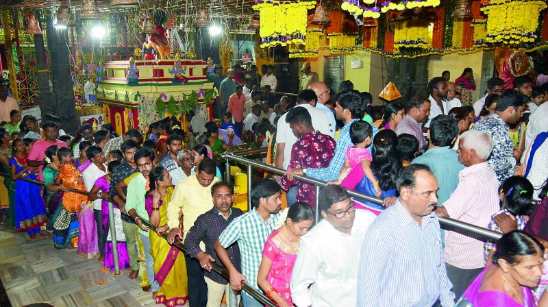 Devotees visit Ujjaini Mahankali temple in Secunderabad for a darshan on the eve of Bonalu. 	(Image: DC)