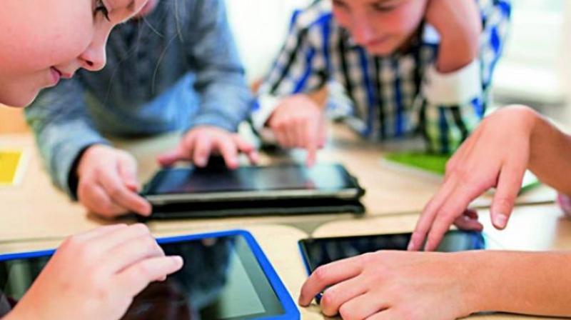 It is time for the parents to introspect themselves by asking are we disabling our children by exposing or giving unrestricted access to  smart phones and tablets and thereby hampering the process of acquiring the basic skills of  holding the pencil.   (Representational Image)