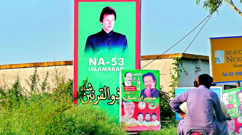 A portrait of Imran Khan is on display near his home in Islamabad on Tuesday. 	(Image:  AP)