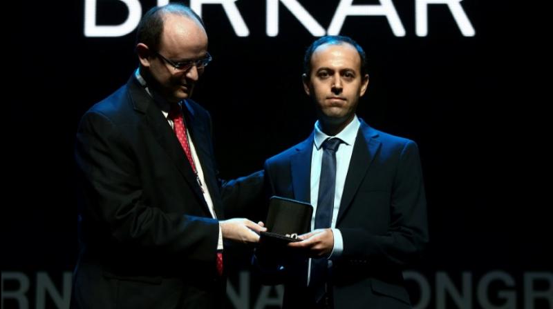 Kurdish mathematician, Caucher Birkar (R), receives the Fields Medal Award, maths most prestigious prize, during the International Congress of Mathematicians (ICM 2018) in Rio de Janeiro. (Photo: AFP)