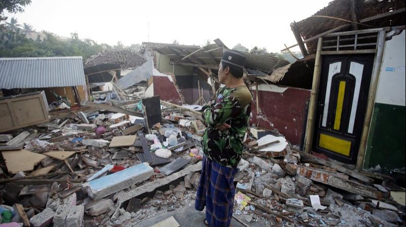 A man inspects the ruin of his house destroyed by an earthquake in North Lombok, Indonesia, Thursday, Aug. 9, 2018. (Photo: AP)