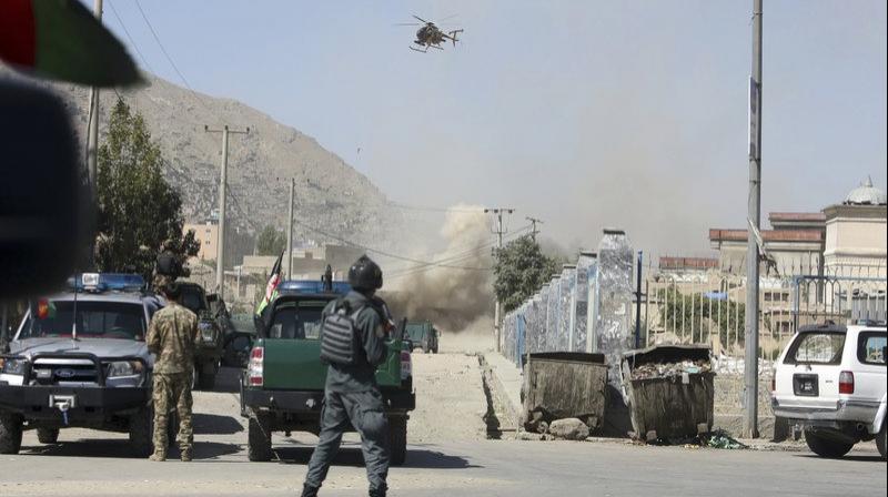 An MD 530F military helicopter targets a house where attackers are hiding in Kabul, Afghanistan, Tuesday, Aug. 21, 2018. (Photo: AP)