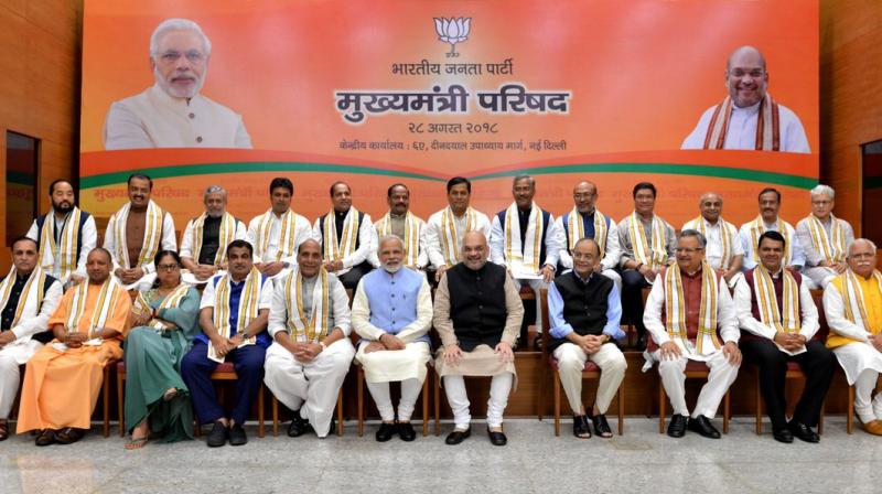 PM Modi, BJP president Amit Shah, senior ministers Rajnath Singh, Nitin Gadkari and Arun Jaitley in a group photograph with the party chief ministers during a day-long meeting of the BJP Chief Ministers Council in New Delhi on Tuesday. (Photo: Twitter | @BJP4India)
