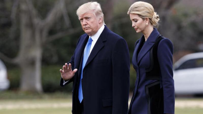 President Donald Trump, accompanied by his daughter Ivanka, waves as they walk to board Marine One on the South Lawn of the White House. (Photo: AP)