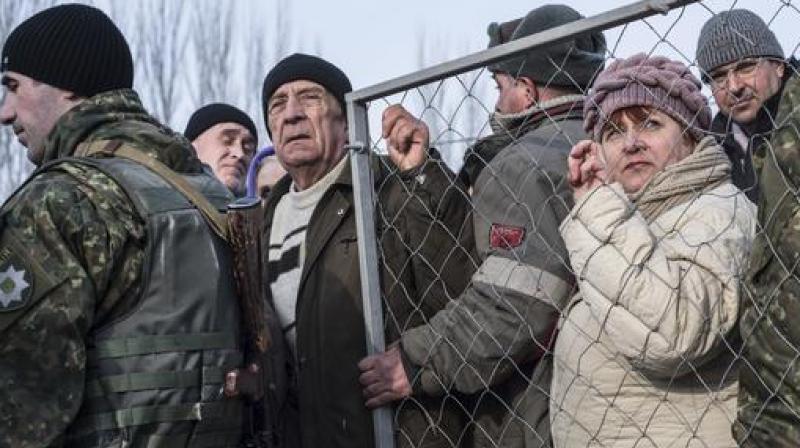 Local residents line up for help at the humanitarian aid center in Avdiivka, eastern Ukraine. (Photo: AP)