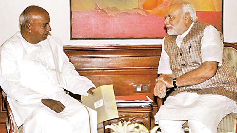 A file photo of JD(S) chief H.D. Deve Gowda with PM Modi