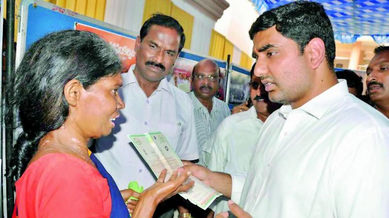 Minister Nara Lokesh speaks to a woman at the collectorate in Kadapa on Tuesday during his visit to the district. (Photo: DC)