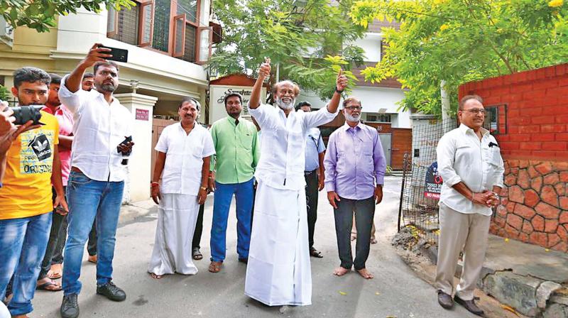 Superstar Rajinikanth, who had announced he would float his own party, greets his fans in Chennai on New Years Day. (Photo: DC)