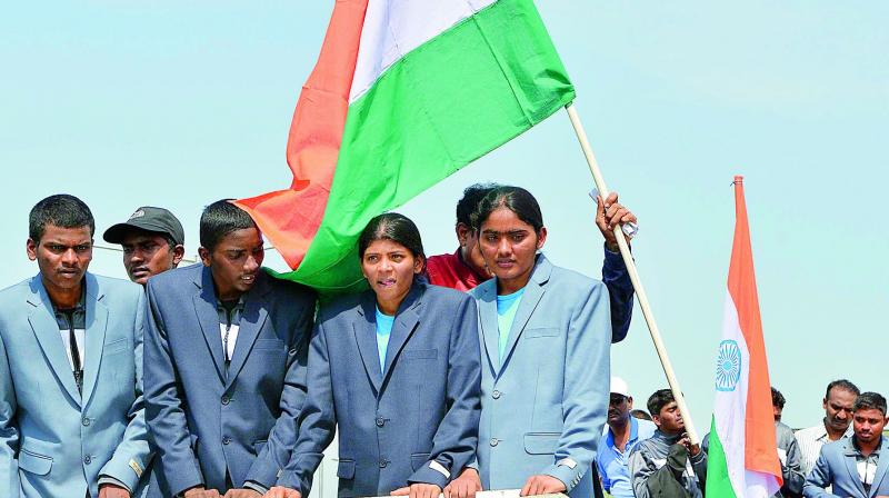 Mount Everest climbers show the victory sign at a rally outside the airport near Vijayawada on Thursday. (Photo: DC)