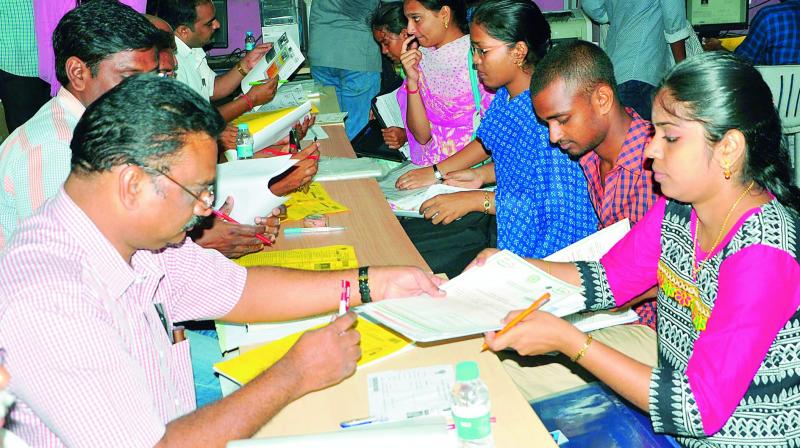 Students get their certificates verified during the counselling process for the entry into PG Courses of AU through AUCET examination, at AU Campus in Visakhapatnam on Thursday. (Photo: DC)