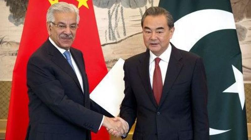 Pakistans Foreign Minister Khawaja Muhammad Asif, left, and Chinese Foreign Minister Wang Yi, right. (Photo: AP/File)
