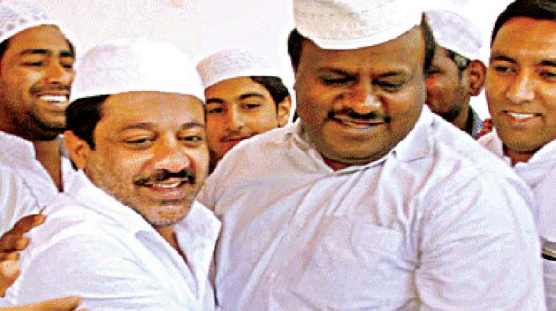 A file photo of suspended JD(S) MLA Zameer Ahmed Khan with state JD(S) chief H.D. Kumaraswamy