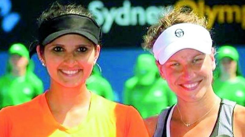Sania Mirza and Barbora Strycova pose with their runners-up trophies at the Apia International tennis tournament in Sydney on Friday. Sania-Strycova lost the final to Timea Babos and Anastasia Pavlyuchenkova 4-6, 4-6.