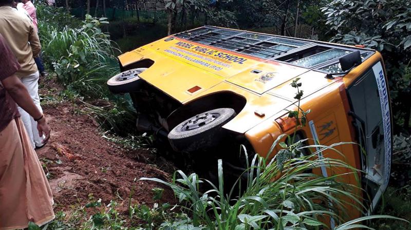 The school bus that slipped off from the road off Venjaramoodu in Thiruvananthapuram on Tuesday. A few children suffered minor injuries.