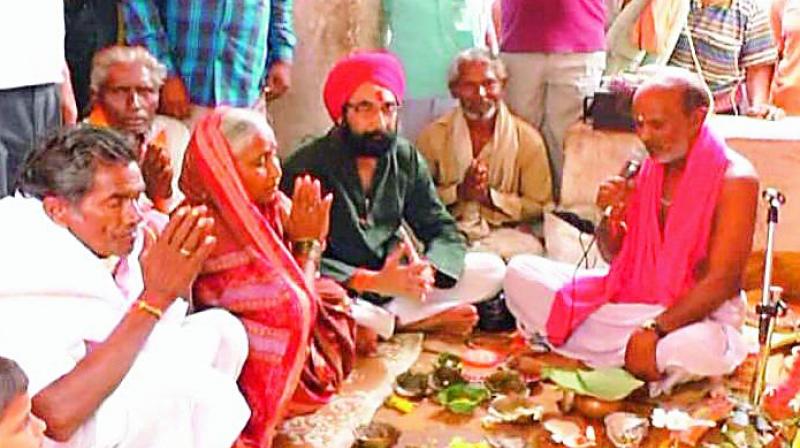 Farmers performing yagna to appease Rain God at Ghantasagada, Sanamula villagers on Tuesday.