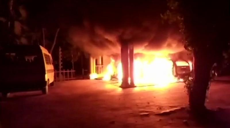 Two cars and a scooter belonging to Swami Sandeepanada Girls School on the outskirts of Thiruvananthapuram were set on fire around 2:30 am. (Photo: ANI | Twitter)