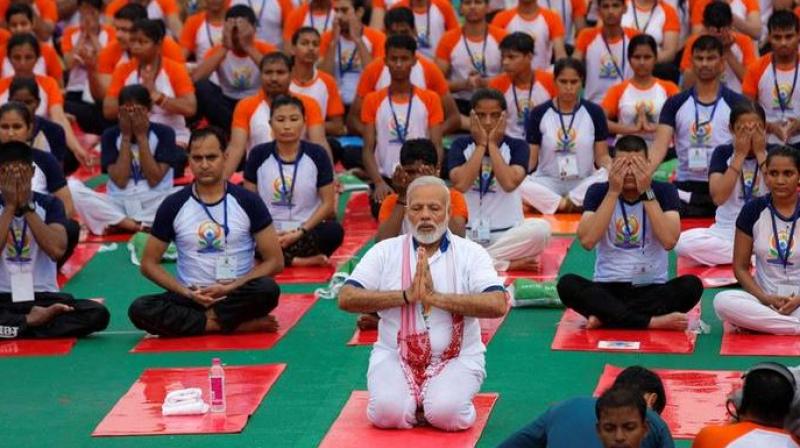 Prime Minister Narendra Modi performs yoga during a mass yoga event on 3rd International Yoga Day in Lucknow on Wednesday. (Photo: PTI)