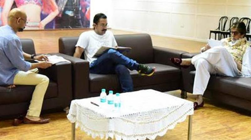 Director Vijay Krishna Acharya, Aamir Khan and Amitabh Bachchan engrossed in a reading session.