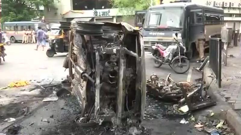 On Wednesday, police had lobbed teargas shells and used baton-charge in Kopar Khairane area after a group of protesters stoned vehicles, clashed with local people and indulged in arson. (Photo: Twitter | ANI)