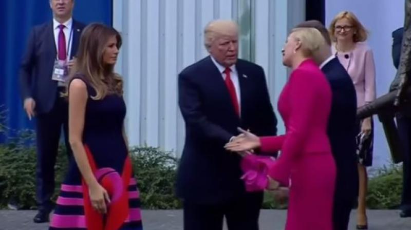 The US and Polands presidential couples were shaking hands Thursday before Trumps speech in front of a crowd in Poland. (Photo: Youtube grab)