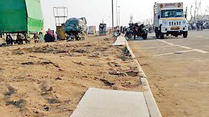 Footpath damaged during  police-protesters clash on Monday (Photo: DC)