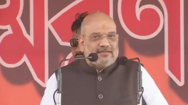BJP president Amit Shah addressed a rally in memory of 3 slain party workers at Balarampur in Purulia on Thursday. (Photo: Twitter/ANI)