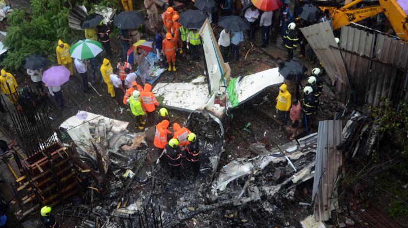 Chartered plane crashes in an open area in Mumbais Ghatkopar on Thursday. (Photo: Shripad Naik)