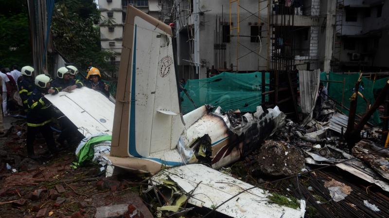 The King Air C90 12-seater aircraft had taken off from the Juhu airport for a test flight and crashed shortly after 1 pm killing all four on board and a pedestrian. (Photo: Shripad Naik)