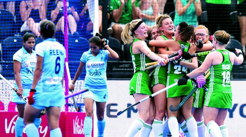 Ireland players celebrate a goal against India in their Pool B match of the Hockey World Cup in London on Thursday. Ireland won 1-0.