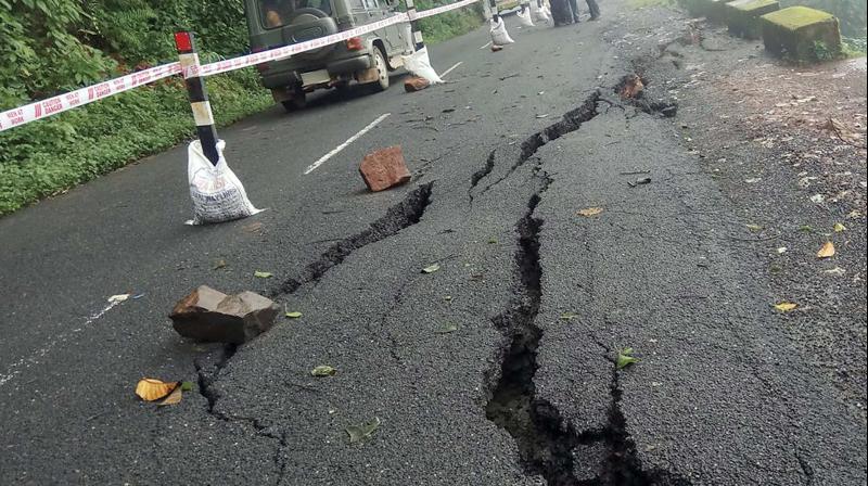 Damaged Gudalur-Calicut road in Kil-Nadugani area near Gudalur in Nilgiris  border. 	 (Image: DC)
