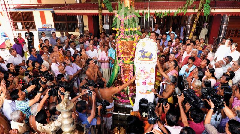 The ceremonial flag being hoisted at the Visalakshi Viswanatha Swami Temple as part of the Kalpathy festival in Palakkad on Monday. (Photo: DC)