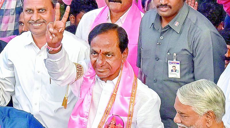 TRS chief K. Chandrasekhar Rao flashes the victory sign after his party won the state Assembly elections, at Telangana Bhavan in Hyderabad on Tuesday.