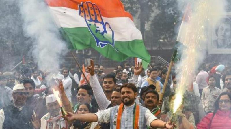 Congress workers celebrate victory in state assembly elections. (Photo: PTI)