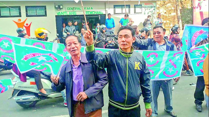 Mizo National Front workers celebrate the partys victory in the Assembly elections, in Aizawl on Tuesday. 	 PTI