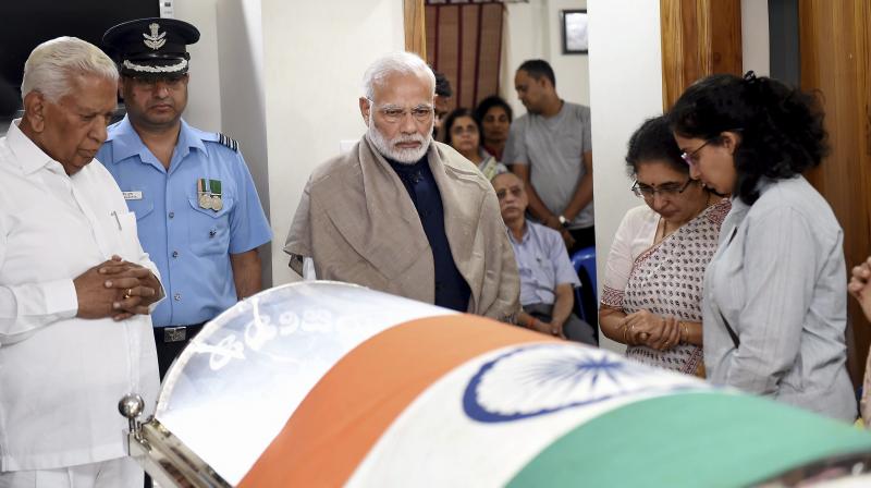 Prime Minister Narendra Modi visited Ananth Kumars residence at Basavanagudi and paid homage to his colleague by placing a wreath on his mortal remains on Monday night. (Photo: PTI)