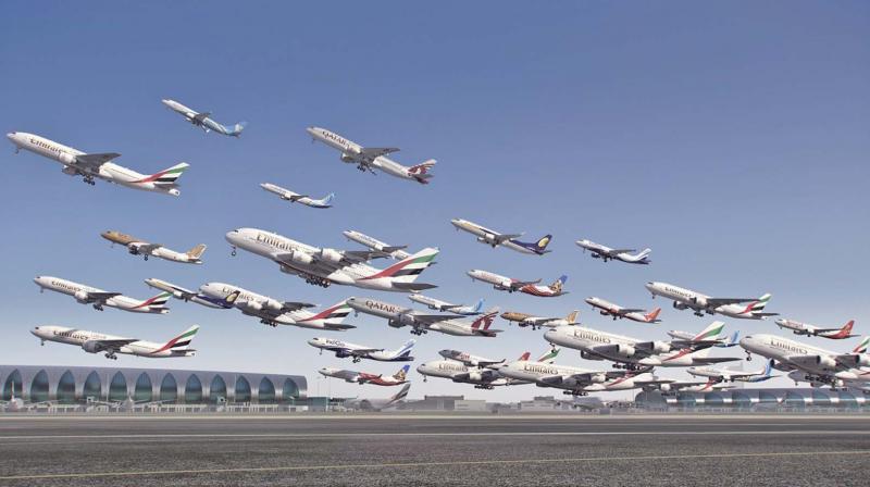 A composite of multiple planes taking off from Dubai airport.