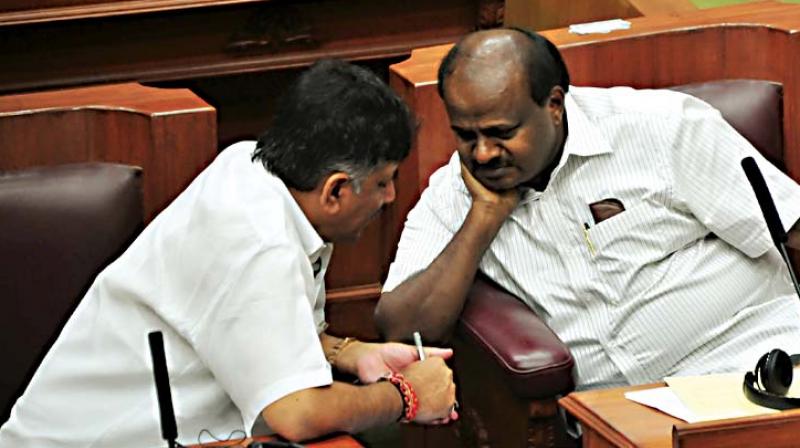 Chief Minister H.D. Kumaraswamy and Water Resources Minister D.K. Shivakumar in discussion during the winter session of the state legislature in Belagavi on Friday